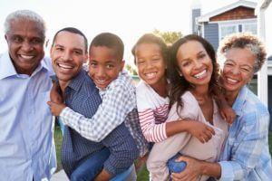 African-American family smiling because of a solid estate plan